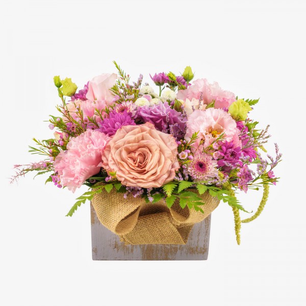 Wooden box with mixed flowers 